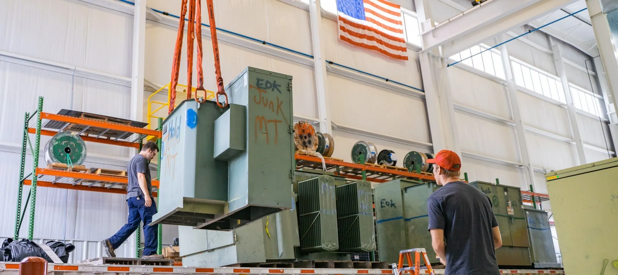 Surplus Padmount transformers bought from a recycler getting unloaded in one of Maddox’s South Carolina shops.