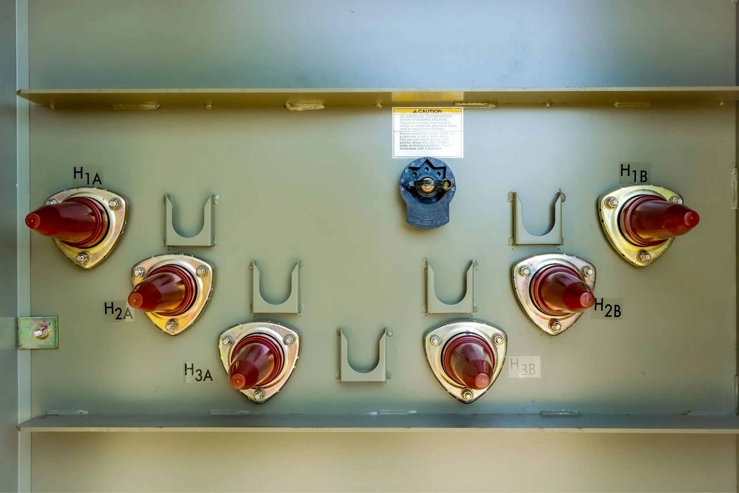A transformer voltage adjustment tap changers on a loop feed padmount transformer