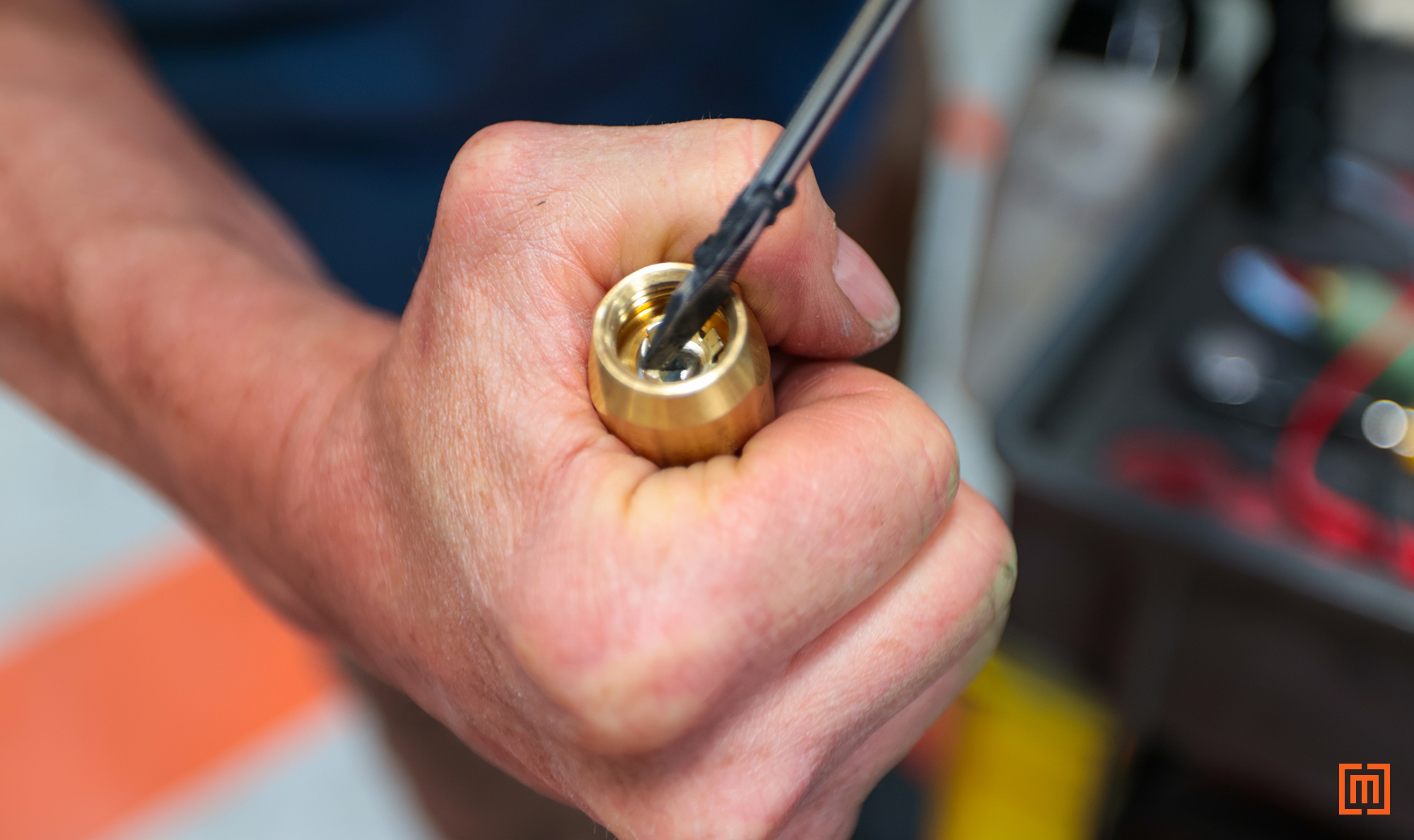 photo of tech adjusting tulip end of bayonet fuse