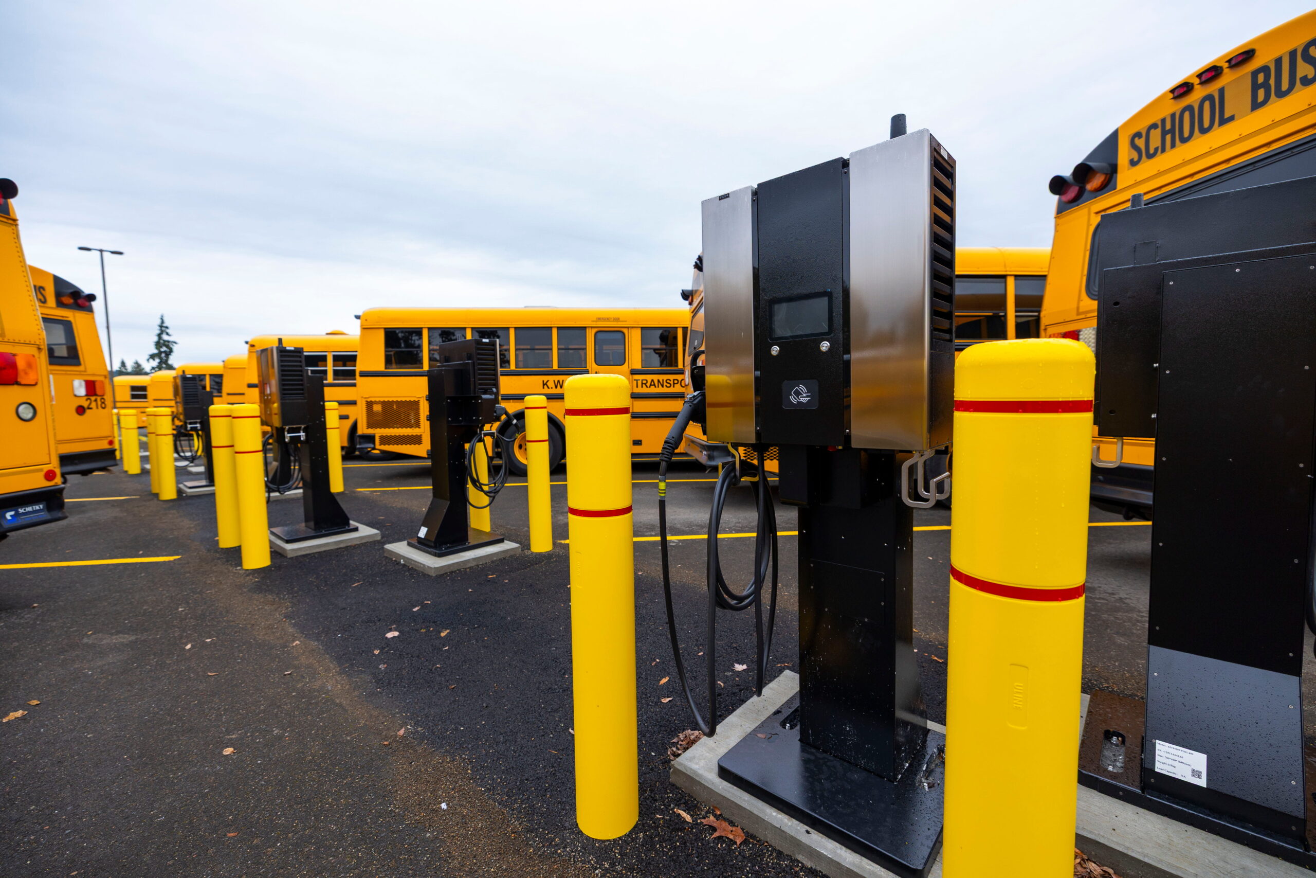 Electric buses in parking lot with fast charging stations