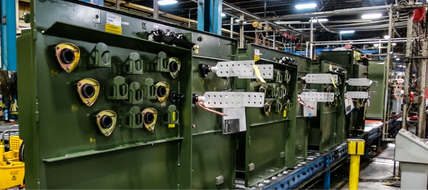 This is an image of padmount transformers in production.
