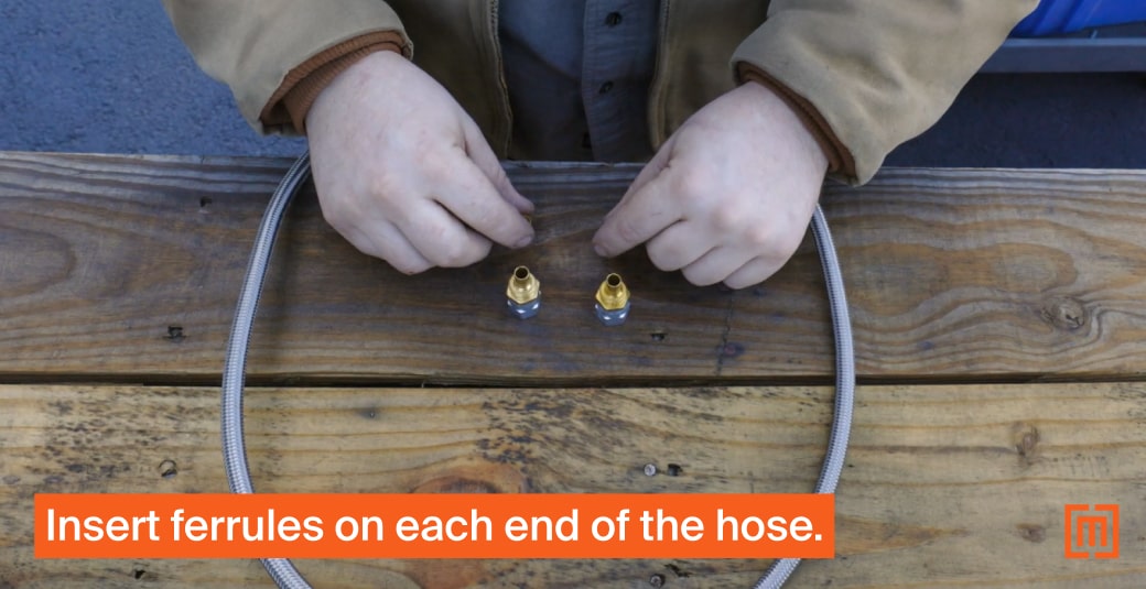 Mechanic adding ferrules to transformer hose