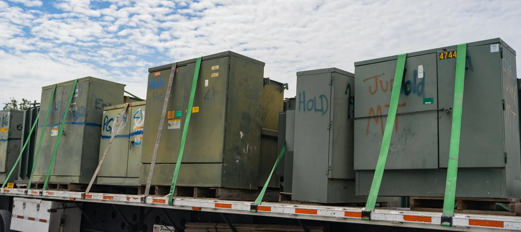 Surplus padmount transformers loaded on a truck