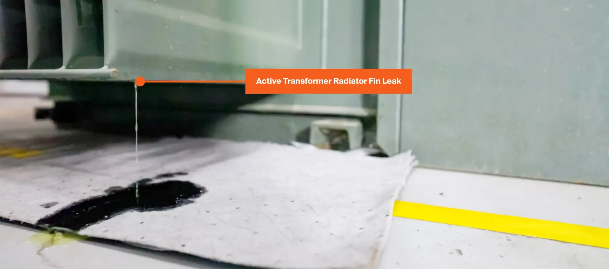 An active transformer oil leak coming from a padmount transformer radiator fin