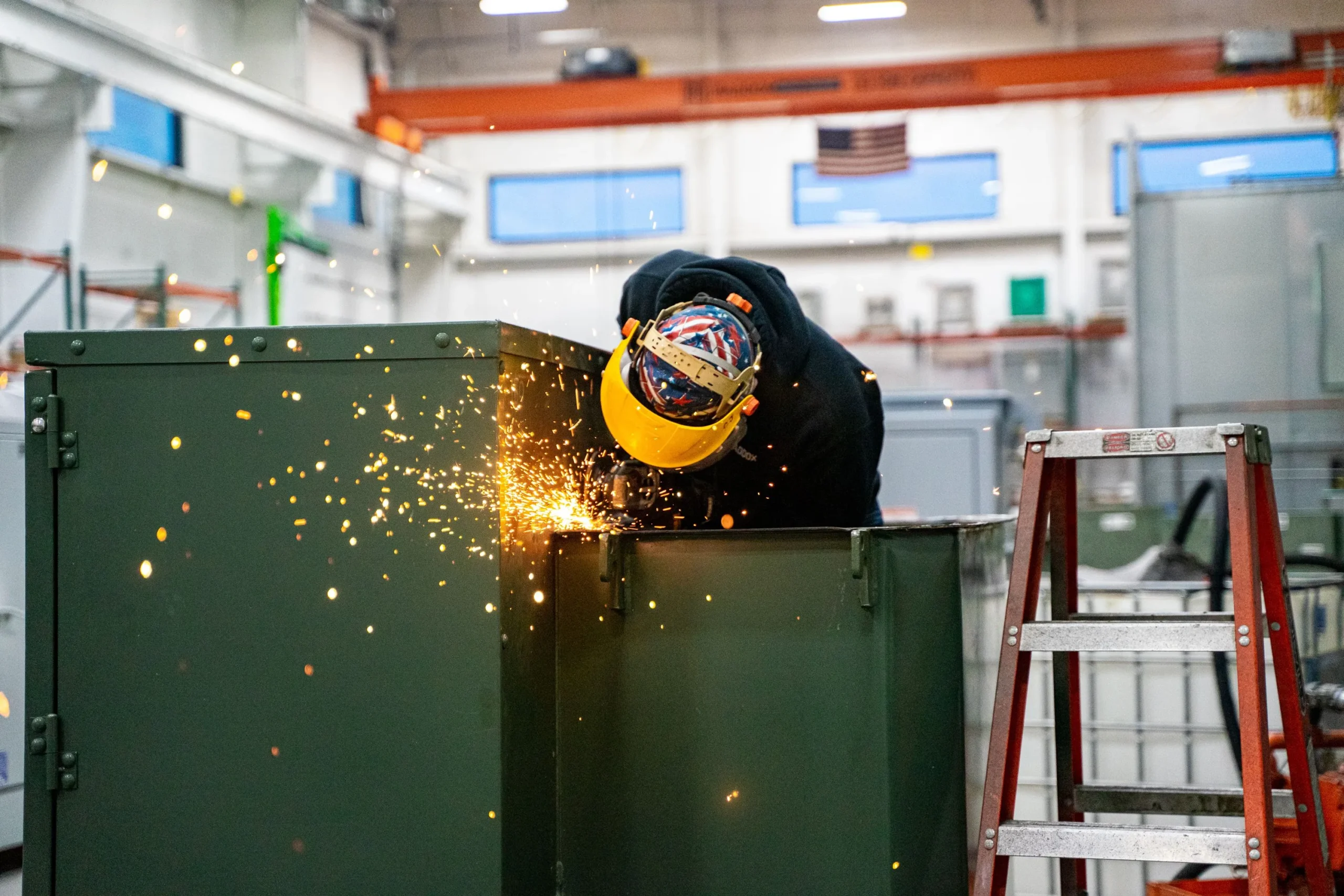 A Maddox shop worker reconditioning a liquid filled padmount transformer