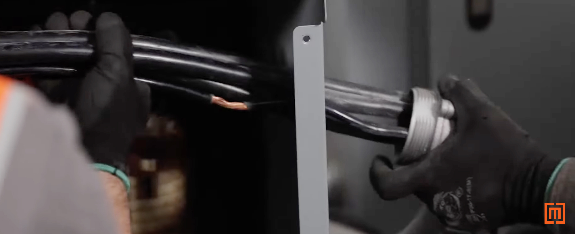 technician feeding cables into new transformer