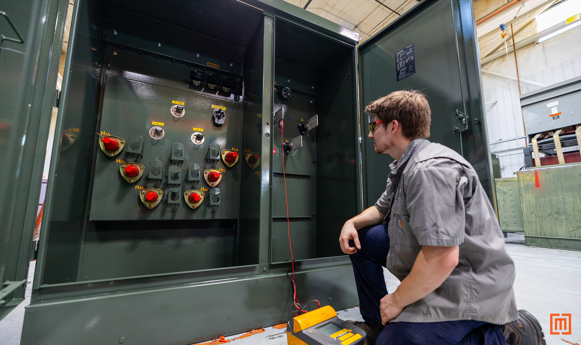 photo of Maddox tech testing padmount transformer