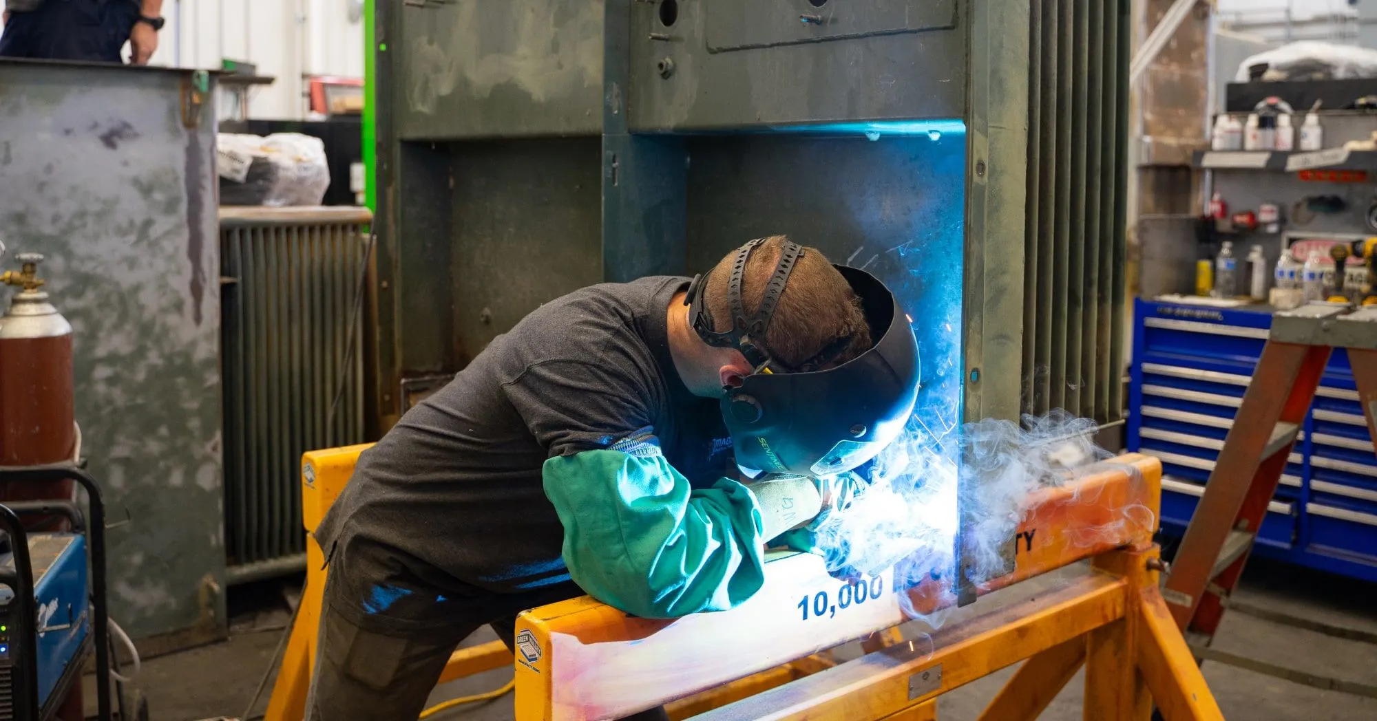 Transformer technician repairing a padmount transformer