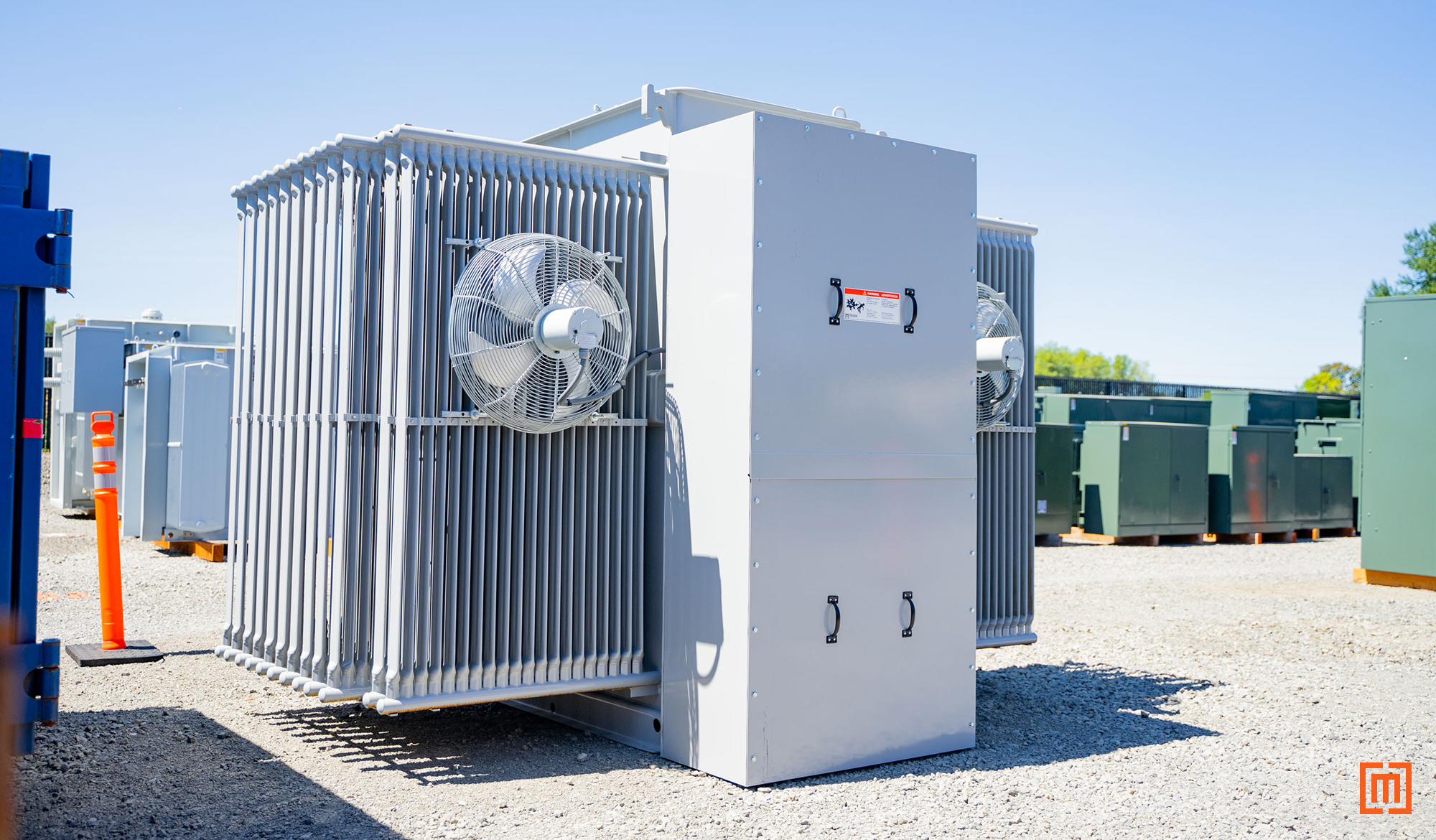 Substation in yard with cooling fans