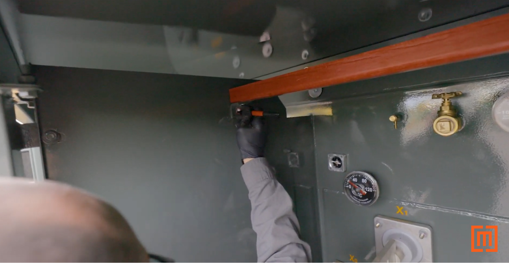 Marking holes to cut on the transformer cabinet