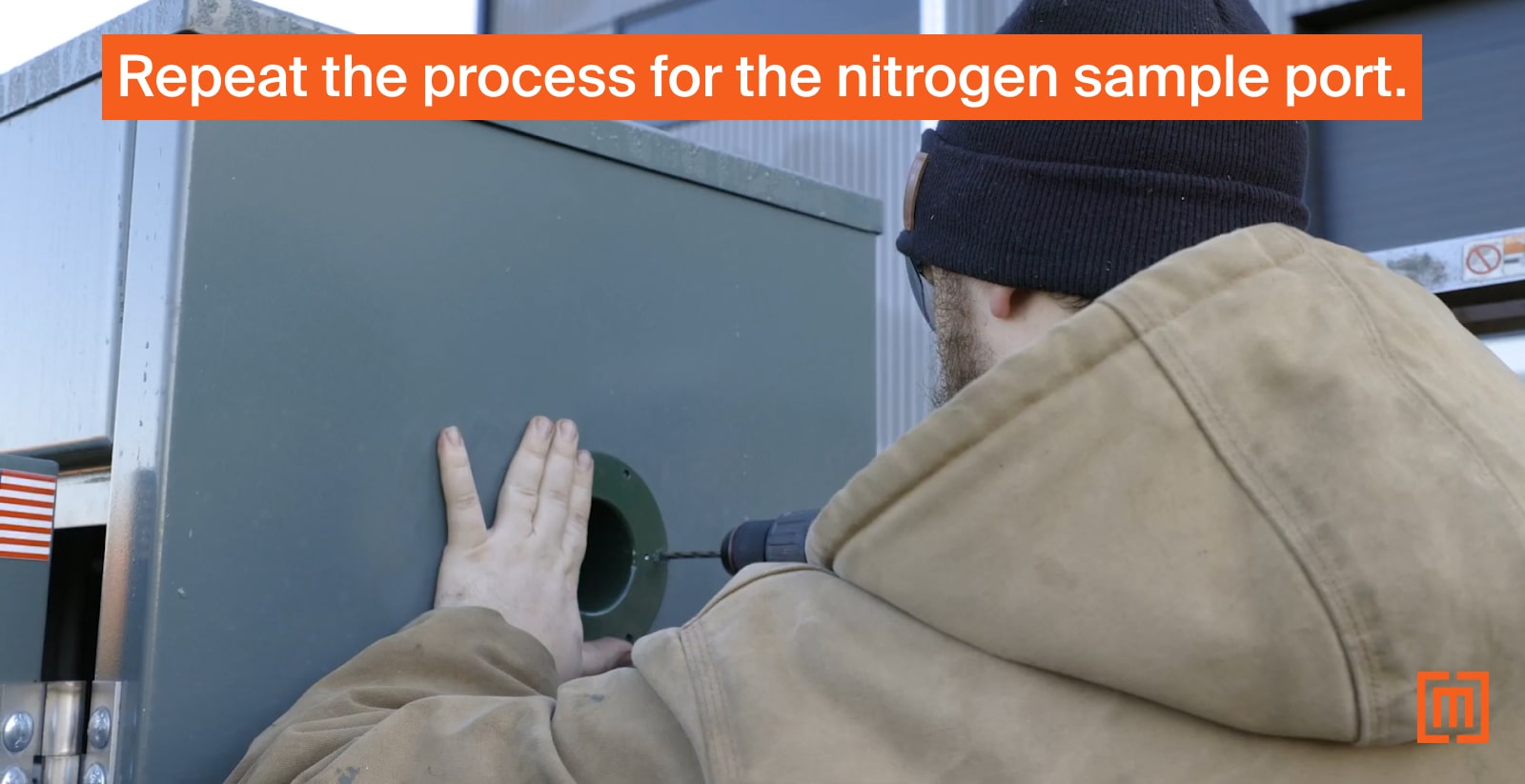 Mechanic drilling pop rivet holes in transformer cabinet exterior