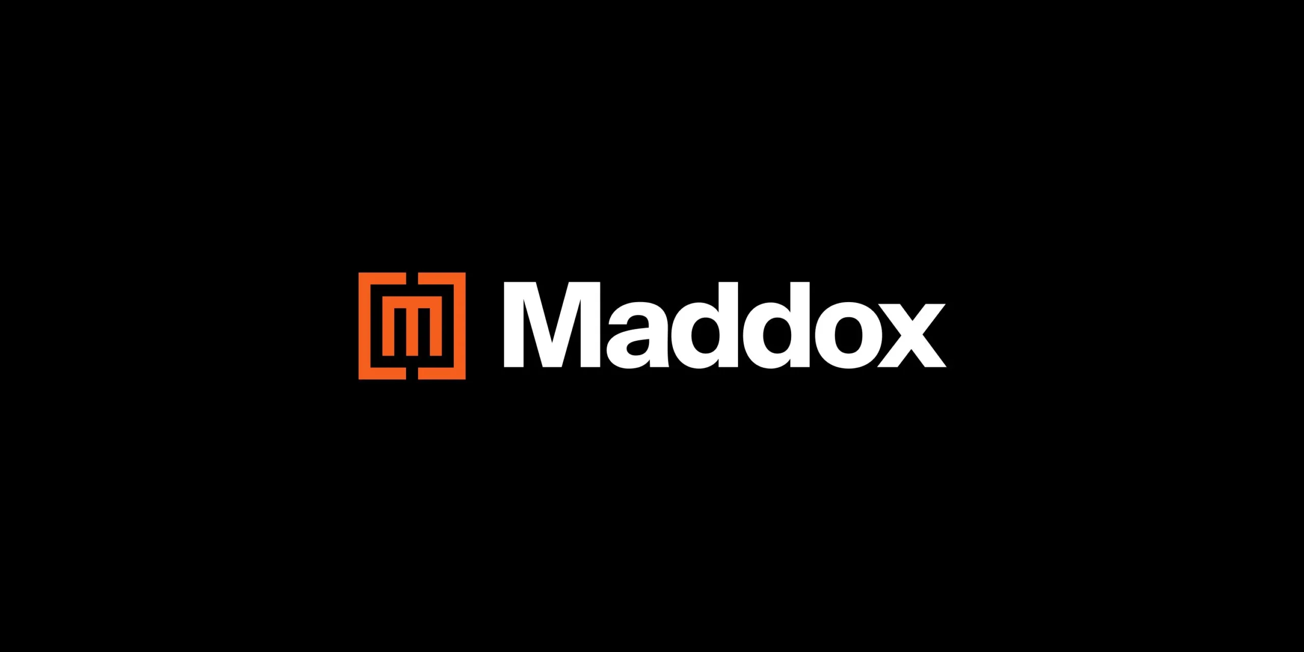 Orange and white Maddox logo on black background