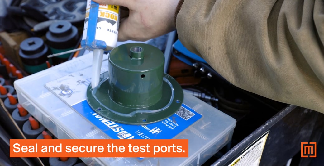 Mechanic adding silicone seal to transformer external port