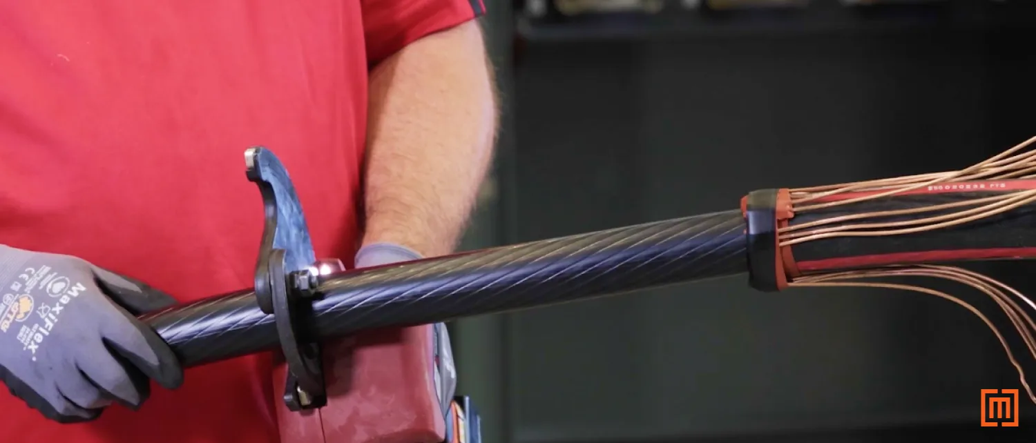 Technician cuts the cable at the new mark