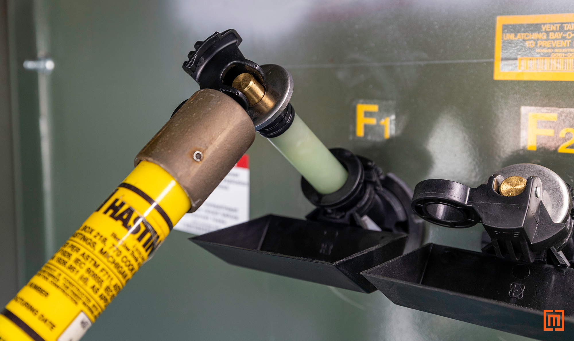 photo of reinstalling fuse holder in padmount using a hot stick